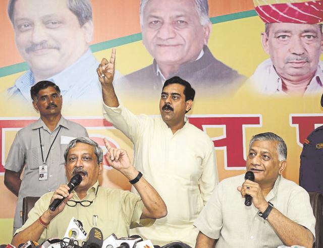 Defence Minister Manohar Parrikar (left) with General (retd) V K Singh (right) in Ghaziabad on Friday. The ministers’ visit was to spread the word about the achievements of the Modi government over the past two years. (Sakib Ali/HT) Defence Minister Manohar Parrikar (left) with General (retd) V K Singh (right) in Ghaziabad on Friday. The ministers’ visit was to spread the word about the achievements of the Modi government over the past two years. (Sakib Ali/HT)