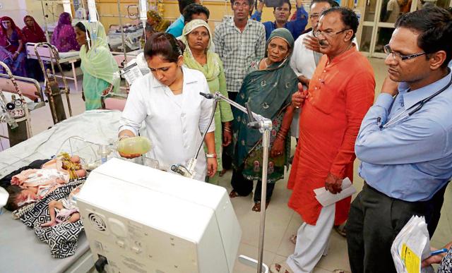 State education minister Vasudev Devnani visited children at Ajmer’s government-run Jawahar Lal Nehru hospital after 16 newborns died between May 15 and 25.(HT File Photo/Deepak Sharma)