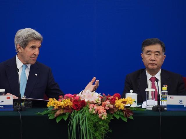 US secretary of state John Kerry, left, speaks as Chinese vice-premier Wang Yang listens to him during a closing statements of the US-China Strategic and Economic Dialogue at the Great Hall of the People in Beijing on Tuesday.(AP)