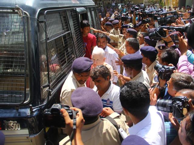 Convicts in Gulbarg Society massacre case seen coming out of the police vehicle for the hearing in Ahmedabad.(Siddharaj Solanki /HT Photo)