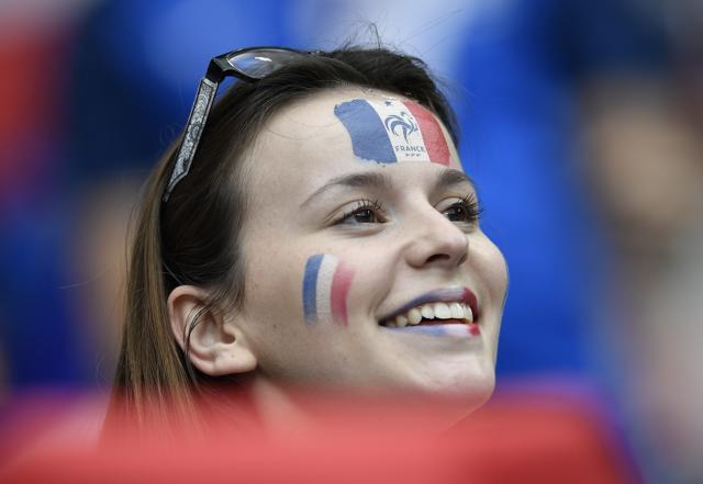 A supporter of France smiles on the stands while waiting for the start of the Euro 2016. (AP Photo) A supporter of France smiles on the stands while waiting for the start of the Euro 2016. (AP Photo)