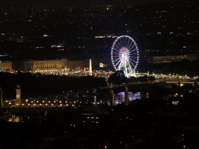 The Place de la Concorde is lit up in the red, white and blue of the French flag. (AP)