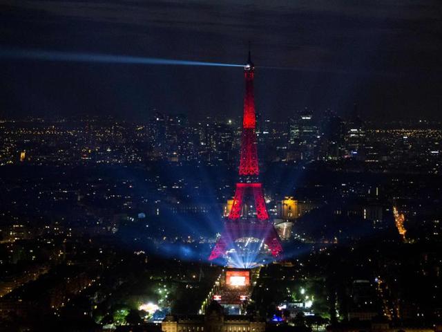 The light show cycled through the red, white and blue of the French flag. (AFP)