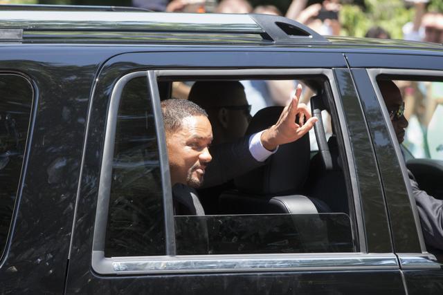 Actor Will Smith greets the crowd as he takes part in Muhammad Ali's funeral procession while they enter Cave Hill Cemetery. (AP Photo) Actor Will Smith greets the crowd as he takes part in Muhammad Ali's funeral procession while they enter Cave Hill Cemetery. (AP Photo)