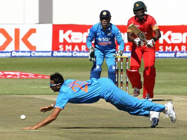 Indian bowler Axar Patel dives to stop the ball during the One Day International. (AP Photo) Indian bowler Axar Patel dives to stop the ball during the One Day International. (AP Photo)