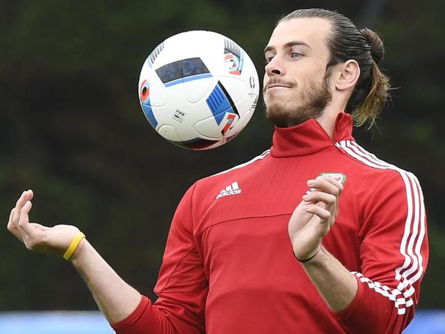 Wales' forward Gareth Bale controls a ball during a training session at the team's training ground in Dinard. (AFP Photo) Wales' forward Gareth Bale controls a ball during a training session at the team's training ground in Dinard. (AFP Photo)