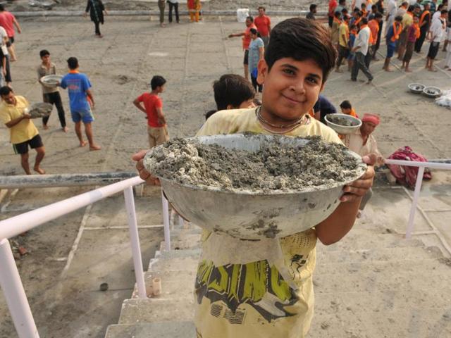 A young kar sevak poses for the camera at Sri Devi Talab Mandir in Jalandhar. (Pardeep Pandit/HT Photo)