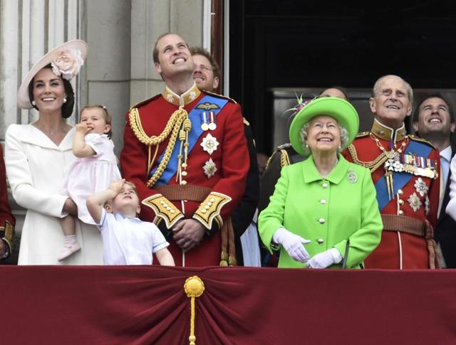 Catherine, Duchess of Cambridge holding Princess Charlotte, Prince George, Prince William and Queen Elizabeth and Prince Philip watch a flypast as they stand on the balcony of Buckingham Palace after the annual Trooping the Colour ceremony on Horseguards Parade in central London on Saturday. (Reuters) Catherine, Duchess of Cambridge holding Princess Charlotte, Prince George, Prince William and Queen Elizabeth and Prince Philip watch a flypast as they stand on the balcony of Buckingham Palace after the annual Trooping the Colour ceremony on Horseguards Parade in central London on Saturday. (Reuters)