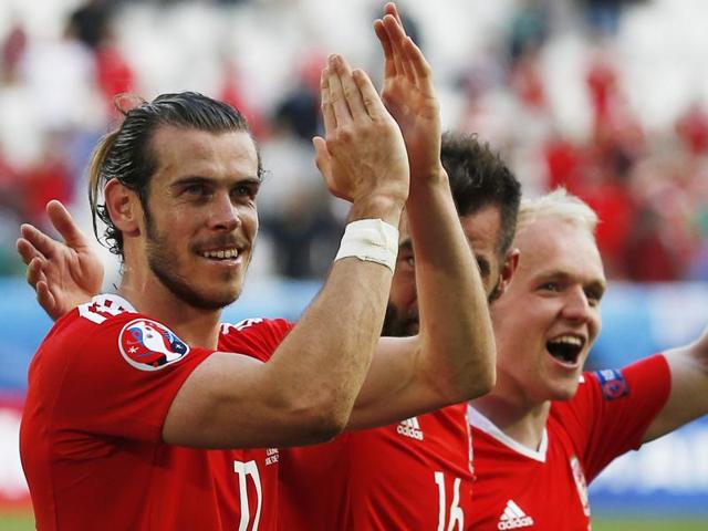 Wales' Gareth Bale (L), Joe Ledley (C) and Jonathan Williams celebrate at the end of the match. (Reuters Photo) Wales' Gareth Bale (L), Joe Ledley (C) and Jonathan Williams celebrate at the end of the match. (Reuters Photo)