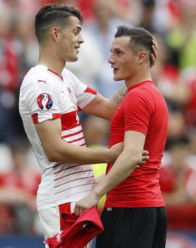 Switzerland's Granit Xhaka, left, described having his brother Albania's Taulant in the opposing team as ‘rather bizarre’. (REUTERS) Switzerland's Granit Xhaka, left, described having his brother Albania's Taulant in the opposing team as ‘rather bizarre’. (REUTERS)