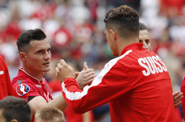 The brothers added a hug to the usual pre-match handshake. (REUTERS) The brothers added a hug to the usual pre-match handshake. (REUTERS)