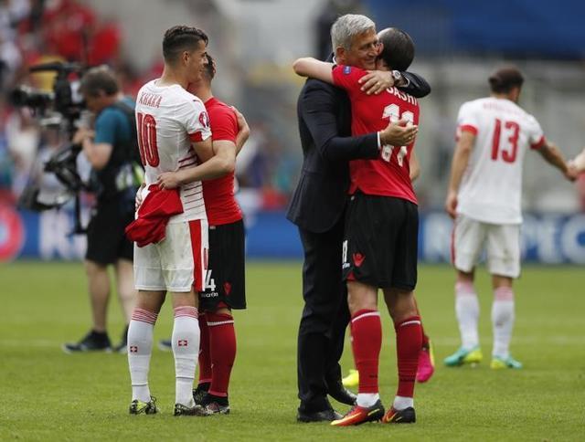 The brothers marked the end of the game with another hug. (Reuters) The brothers marked the end of the game with another hug. (Reuters)