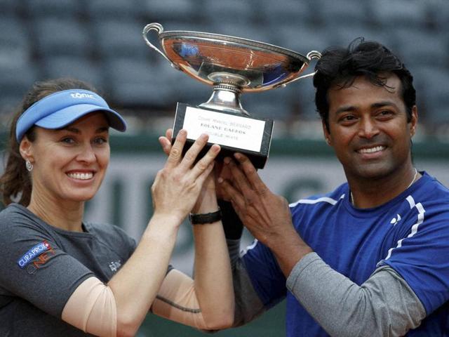 Switzerland’s Martina Hingis, left, and India’s Leander Paes hold the trophy after winning the mixed doubles final of the French Open. (AP Photo) Switzerland’s Martina Hingis, left, and India’s Leander Paes hold the trophy after winning the mixed doubles final of the French Open. (AP Photo)