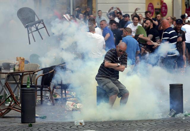 A teargas grenade explodes near an England fan ahead of the match. (REUTERS) A teargas grenade explodes near an England fan ahead of the match. (REUTERS)