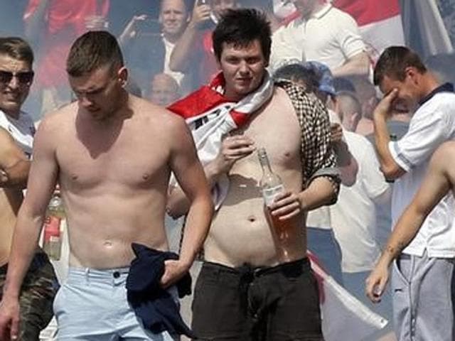 England supporters throw projectiles amongst tear gas at the port of Marseille before the game. (Reuters Photo) England supporters throw projectiles amongst tear gas at the port of Marseille before the game. (Reuters Photo)