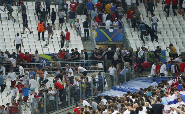 England fans try to escape trouble in the stadium as clashes break out. (REUTERS) England fans try to escape trouble in the stadium as clashes break out. (REUTERS)