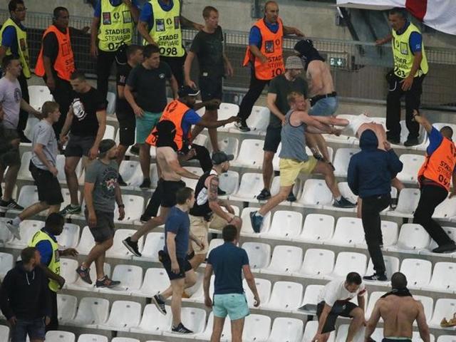 Violence erupts in the stands after the match. (Reuters) Violence erupts in the stands after the match. (Reuters)