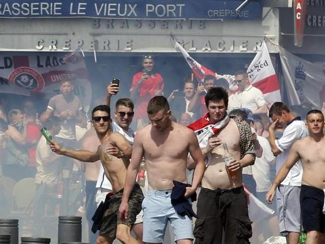 England supporters throw projectiles as they clash with police in Marseille before the game. For the third day, fans clashed with the authorities. (Reuters) England supporters throw projectiles as they clash with police in Marseille before the game. For the third day, fans clashed with the authorities. (Reuters)