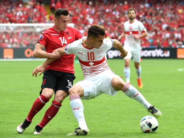 Switzerland's midfielder Granit Xhaka (R) vies for the ball with his brother Taulant Xhaka (L) of Albania. The Xhaka brothers became the first siblings to play in opposite sides at the European Championships. (AFP) Switzerland's midfielder Granit Xhaka (R) vies for the ball with his brother Taulant Xhaka (L) of Albania. The Xhaka brothers became the first siblings to play in opposite sides at the European Championships. (AFP)