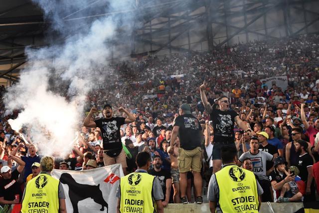 Russian supporters lit flares inside the stadium. (AFP) Russian supporters lit flares inside the stadium. (AFP)