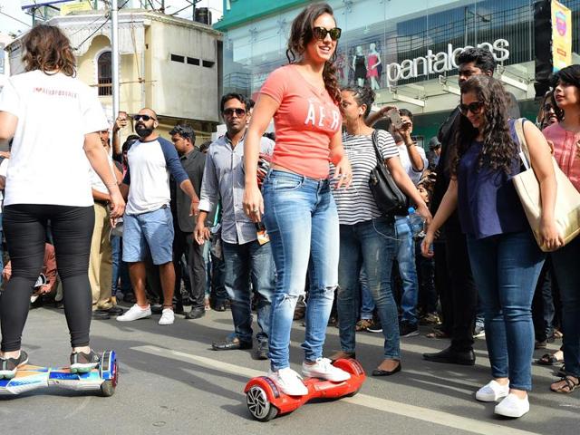 Lauren Gottlieb takes part in an event on a hover board in Bangalore. (AFP) 