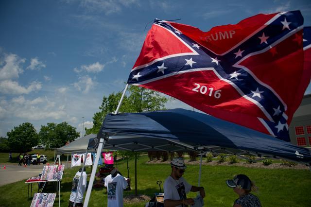 Memorabilia is sold before Republican candidate for President Donald Trump speaks to supporters at a rally at Atlantic Aviation. (AFP)