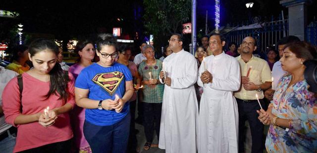 People pray for quick return of Judith D'Souza in Kolkata on Saturday. (PTI)