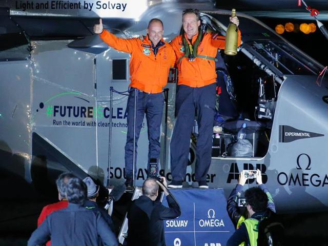 Andre Borschberg (R) and Bertrand Piccard celebrate after the successful landing of the Solar Impulse 2 aircraft at JFK International Airport on June 11, 2016 in Queens, New York. Solar Impulse 2 landed in New York early June 11, after flying by the Statue of Liberty at the end of the US portion of its bid to circle the globe using only solar power. (AFP) Andre Borschberg (R) and Bertrand Piccard celebrate after the successful landing of the Solar Impulse 2 aircraft at JFK International Airport on June 11, 2016 in Queens, New York. Solar Impulse 2 landed in New York early June 11, after flying by the Statue of Liberty at the end of the US portion of its bid to circle the globe using only solar power. (AFP)