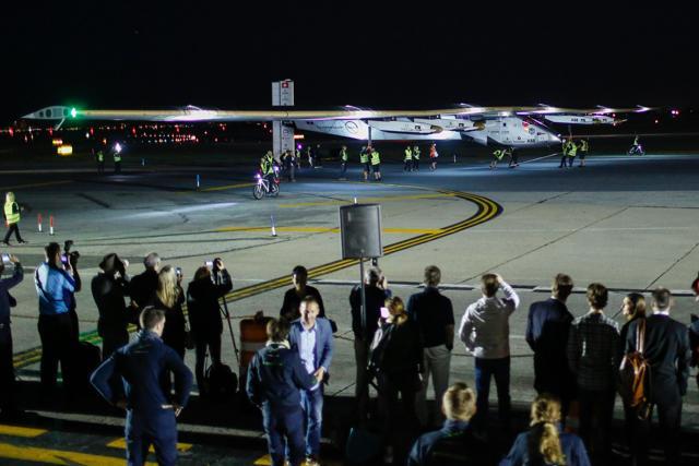 People watch the arrival of the Solar Impulse 2 aircraft following its successful landing at JFK International Airport on June 11, 2016 in Queens, New York. (AFP) People watch the arrival of the Solar Impulse 2 aircraft following its successful landing at JFK International Airport on June 11, 2016 in Queens, New York. (AFP)