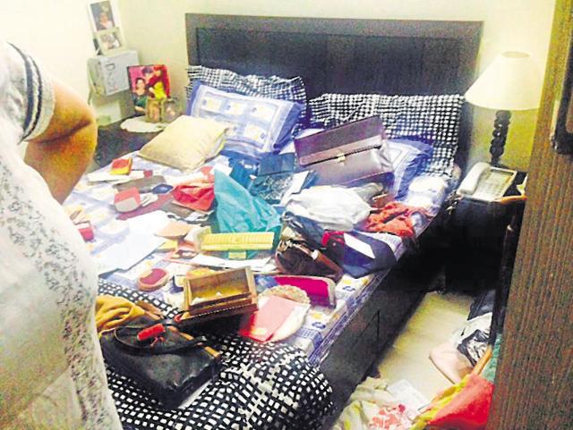 Materials scattered in the room after cash and jewellery were stolen. Materials scattered in the room after cash and jewellery were stolen.