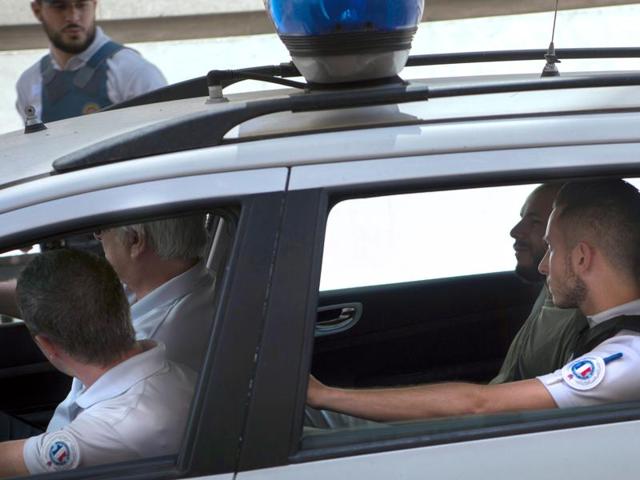 An alleged football supporter arrives with policemen on June 13, 2016 at the courthouse of Marseille, southern France, following clashes during the Euro 2016 match between England and Russia at the Velodrome stadium on June 11. (AFP) An alleged football supporter arrives with policemen on June 13, 2016 at the courthouse of Marseille, southern France, following clashes during the Euro 2016 match between England and Russia at the Velodrome stadium on June 11. (AFP)
