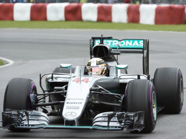 Mercedes driver Lewis Hamilton celebrates winning the race. (Reuters Photo) Mercedes driver Lewis Hamilton celebrates winning the race. (Reuters Photo)