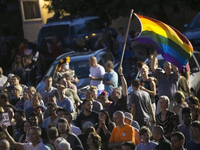 Hundreds gather to mourn the loss of dozens of Americans killed the night before in a mass-shooting in Orlando, Fla., at the Phoenix Pride LGBT Centre on Sunday, June 12, 2016, in Phoenix, Arizona.(AP)