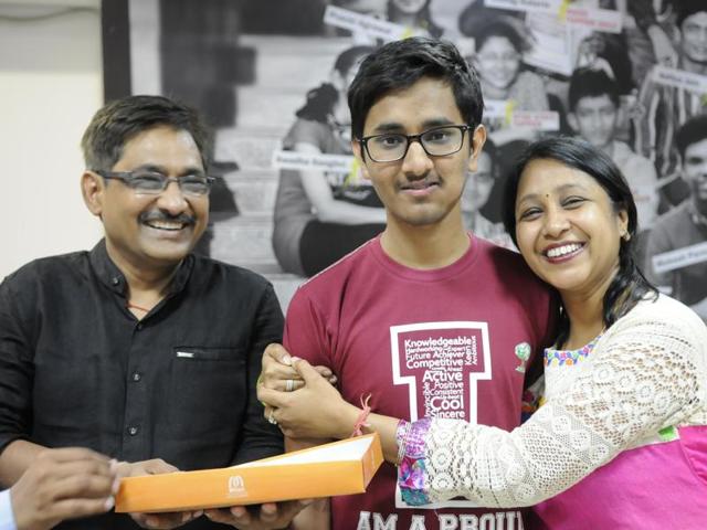 Sharvik Mital who secured AIR 29 in the IIT-JEE Advanced examinations with his parents. (Hindustan Times) Sharvik Mital who secured AIR 29 in the IIT-JEE Advanced examinations with his parents. (Hindustan Times)
