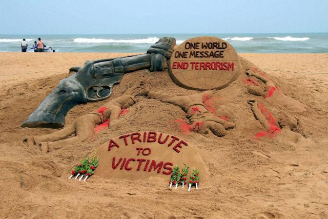 Renowned sand artist Sudarsan Pattnaik gives tribute to the victims of Orlando terrorist attack with the message “One World, One Message, End Terrorism” in Puri. (PTI)