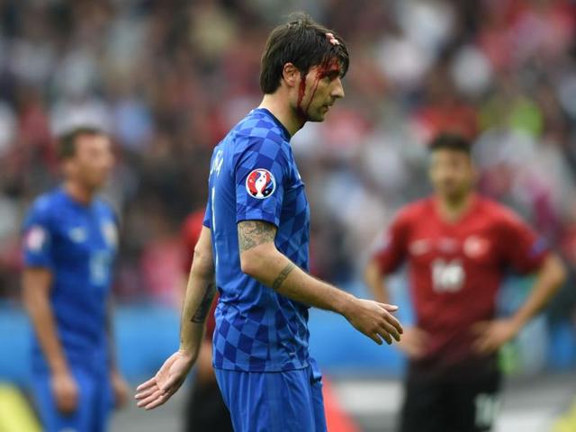 Croatia's defender Vedran Corluka walks off the pitch with a head injury. (AFP Photo) Croatia's defender Vedran Corluka walks off the pitch with a head injury. (AFP Photo)