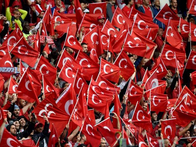Turkey fans wave the national flag. (AFP Photo) Turkey fans wave the national flag. (AFP Photo)