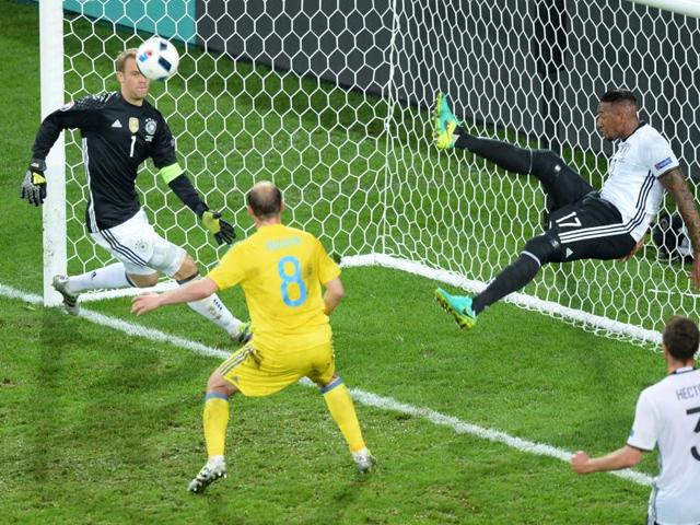 Germany's defender Jerome Boateng (2ndR) kicks the ball from his goal line. (AFP Photo) Germany's defender Jerome Boateng (2ndR) kicks the ball from his goal line. (AFP Photo)