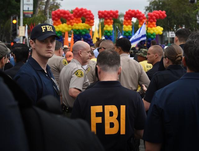 FBI agents keep watch during the 2016 Gay Pride Parade in West Hollywood, California on Sunday. (AFP) FBI agents keep watch during the 2016 Gay Pride Parade in West Hollywood, California on Sunday. (AFP)