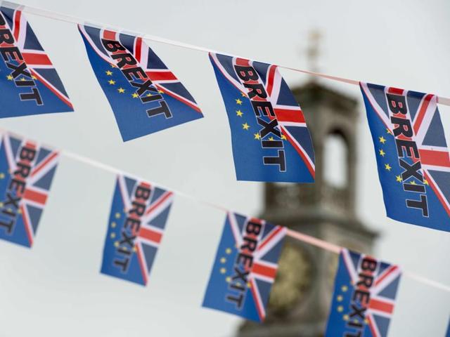 Pro-Brexit flags fly from a fishing boat moored in Ramsgate on June 13, 2016.(AFP)