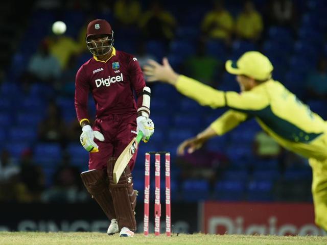 George Bailey (R) dives to stop a shot by West Indies batsman Marlon Samuels hits a boundary off bowler Mitchell Marsh. (AFP Photo) George Bailey (R) dives to stop a shot by West Indies batsman Marlon Samuels hits a boundary off bowler Mitchell Marsh. (AFP Photo)