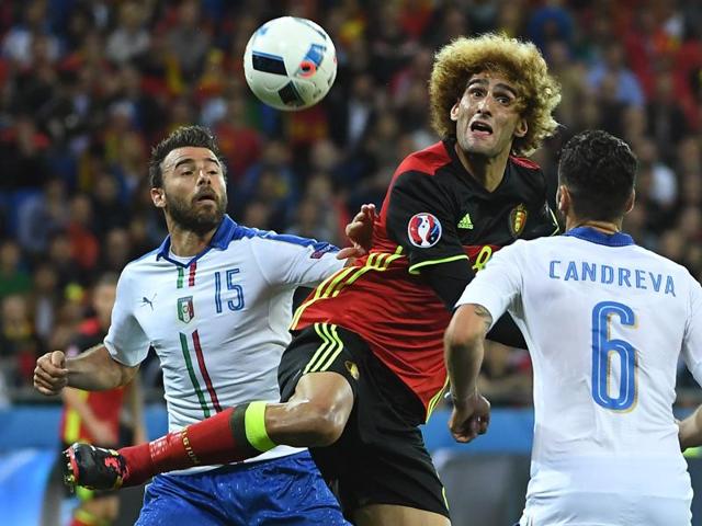 Belgium's midfielder Marouane Fellaini (C) vies with Italy's defender Andrea Barzagli (L) and Italy's midfielder Antonio Candreva. (AFP photo) Belgium's midfielder Marouane Fellaini (C) vies with Italy's defender Andrea Barzagli (L) and Italy's midfielder Antonio Candreva. (AFP photo)