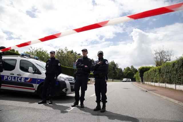 French police officers block the road leading to a crime scene the day after a knife-wielding attacker stabbed to death a senior police officer and his female companion on Monday evening in Magnanville, west of Paris. (AP Photo) French police officers block the road leading to a crime scene the day after a knife-wielding attacker stabbed to death a senior police officer and his female companion on Monday evening in Magnanville, west of Paris. (AP Photo)