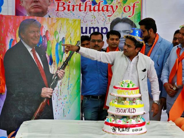 Members of Hindu Sena, a right wing Hindu group, celebrate US Republican presidential candidate Donald Trump's birthday in New Delhi on June 14.(REUTERS)