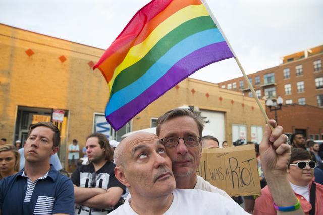 People participate in a candlelit vigil for the victims of the Orlando gay nightclub attack, in Chicago on Monday.(AP)