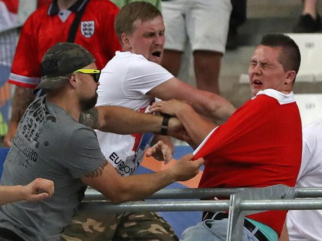 Russian supporters attack an England fan at the end of the Euro 2016 Group B match.(AP Photo)