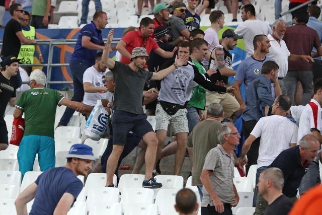Russian supporters charges at England fans in the stands at the end of the Euro 2016 Group B match between England and Russia. (AP Photo)