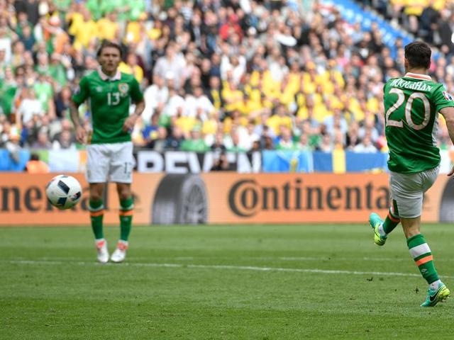 Hoolahan, right, scores the opening goal. (AP)