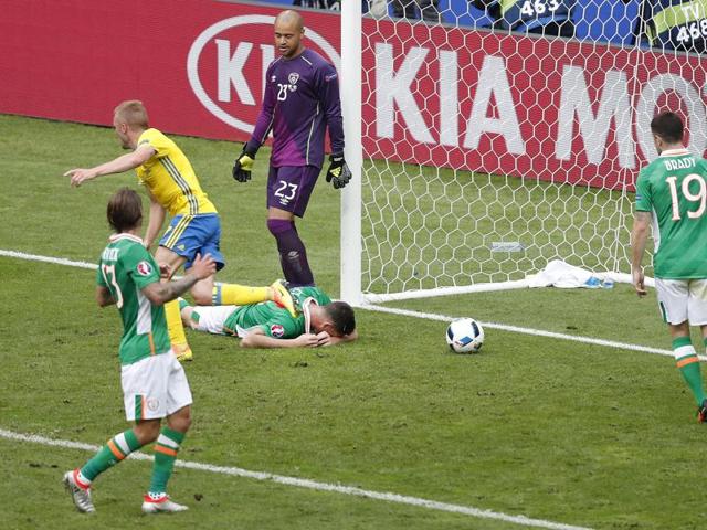 Republic of Ireland's Ciaran Clark, lies on the ground after scoring an own goal from a cross by Ibrahimovic. (AP)