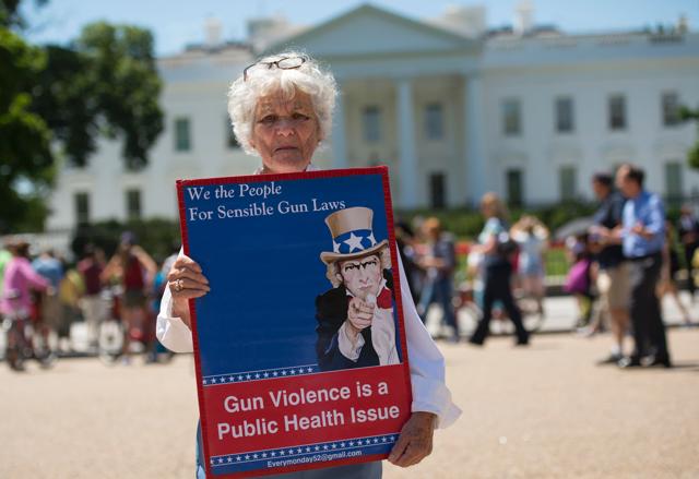 People gather to protest gun violence and call for sensible gun laws outside the White House June 13, 2016, in Washington, DC.(AFP)